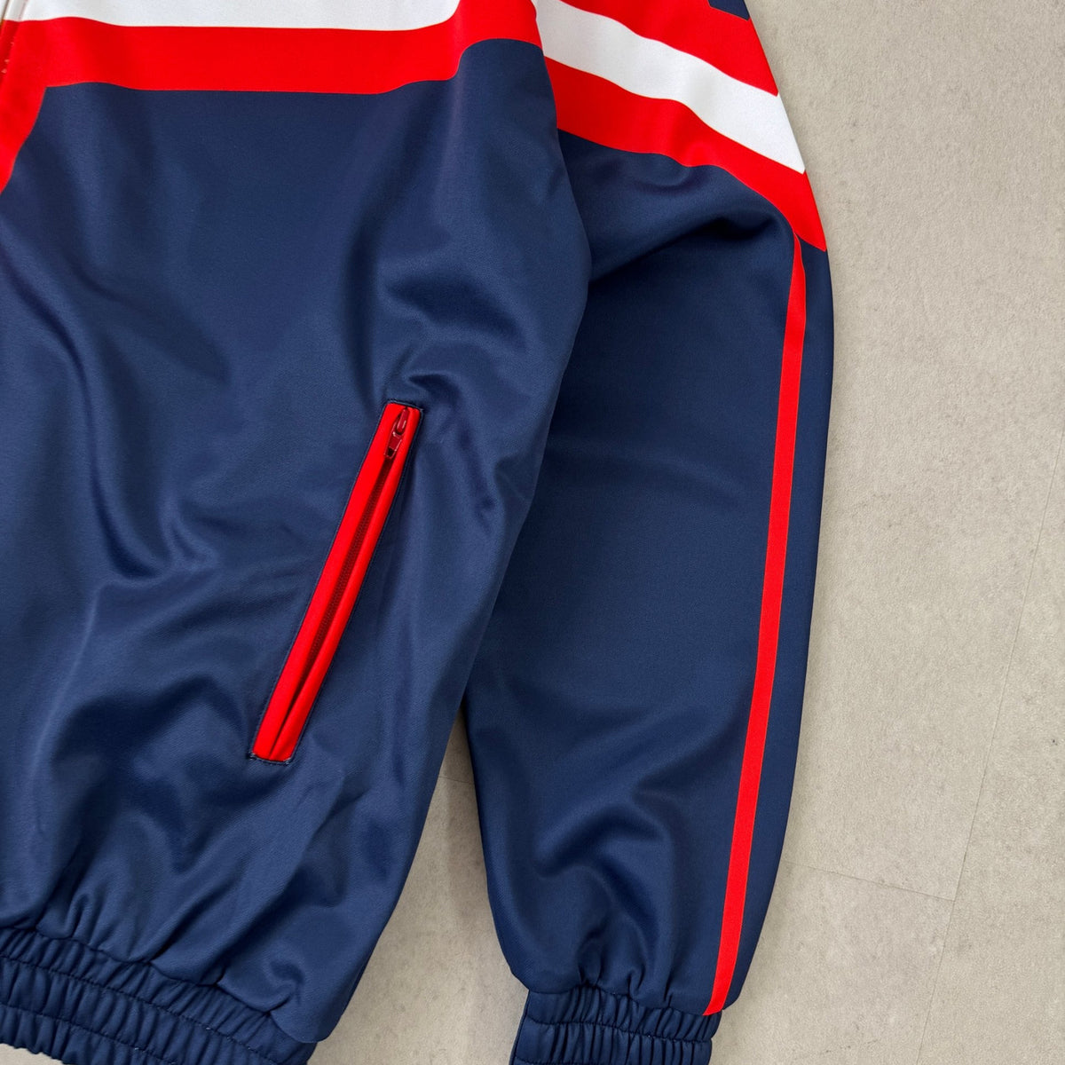 'ALL MIGHT' Track Jacket - sleeve and pocket detail