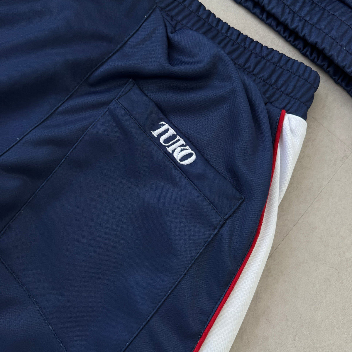 'ALL MIGHT' Track Pants - waistband and pocket detail