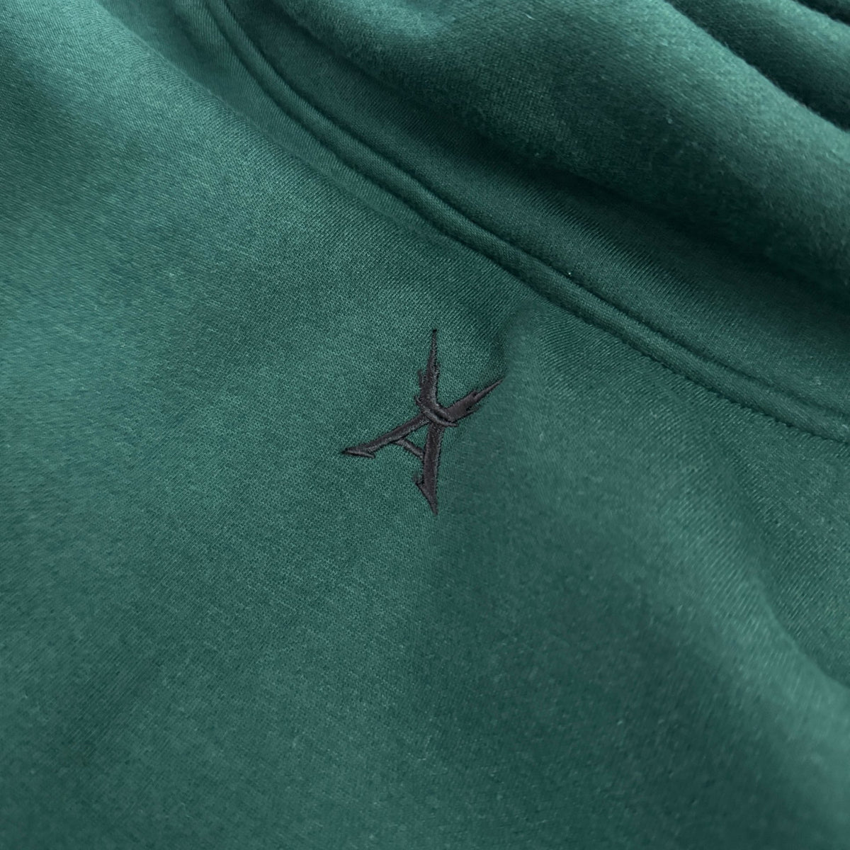 'DEKU' Masked Hoodie - embroidered chest logo close-up