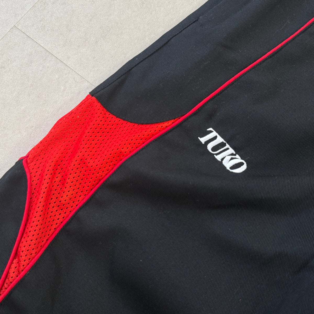 'HELLFIRE' Track Pants - TUKO logo and red mesh panel detail