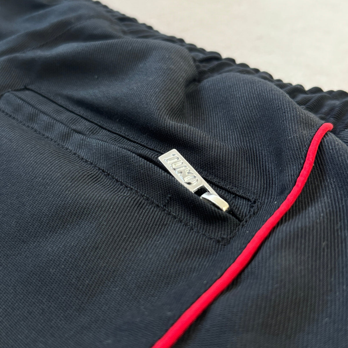 'HELLFIRE' Track Pants - zip pocket with TUKO puller and red piping