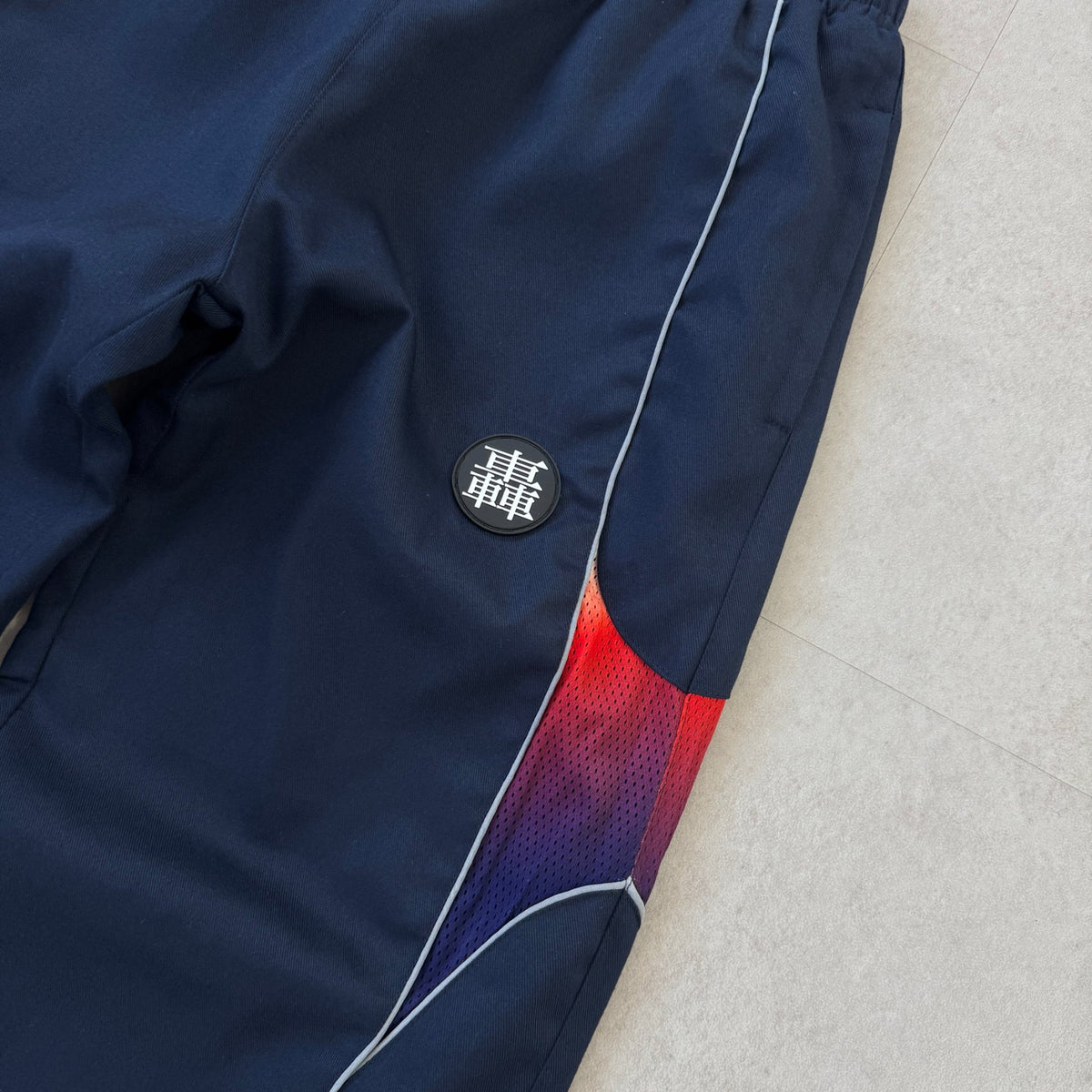 'HOT / COLD' Track Pants - rubber patch and gradient mesh panel detail