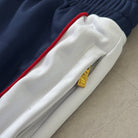 'ALL MIGHT' Track Pants - side stripe and hem detail