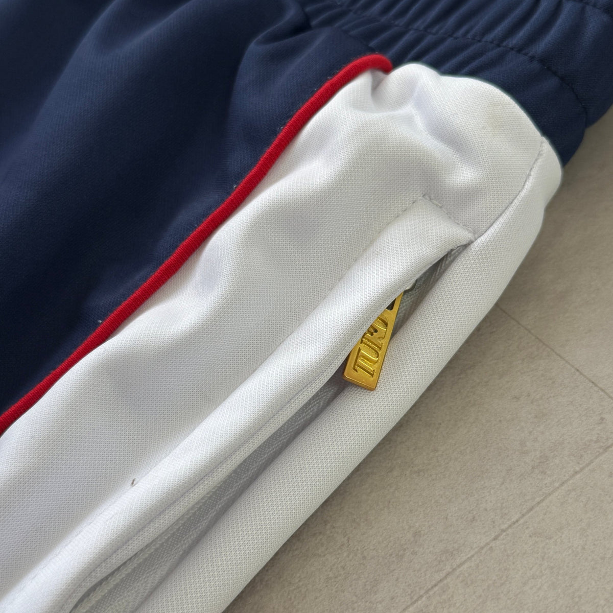 'ALL MIGHT' Track Pants - side stripe and hem detail