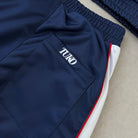 'ALL MIGHT' Track Pants - waistband and pocket detail