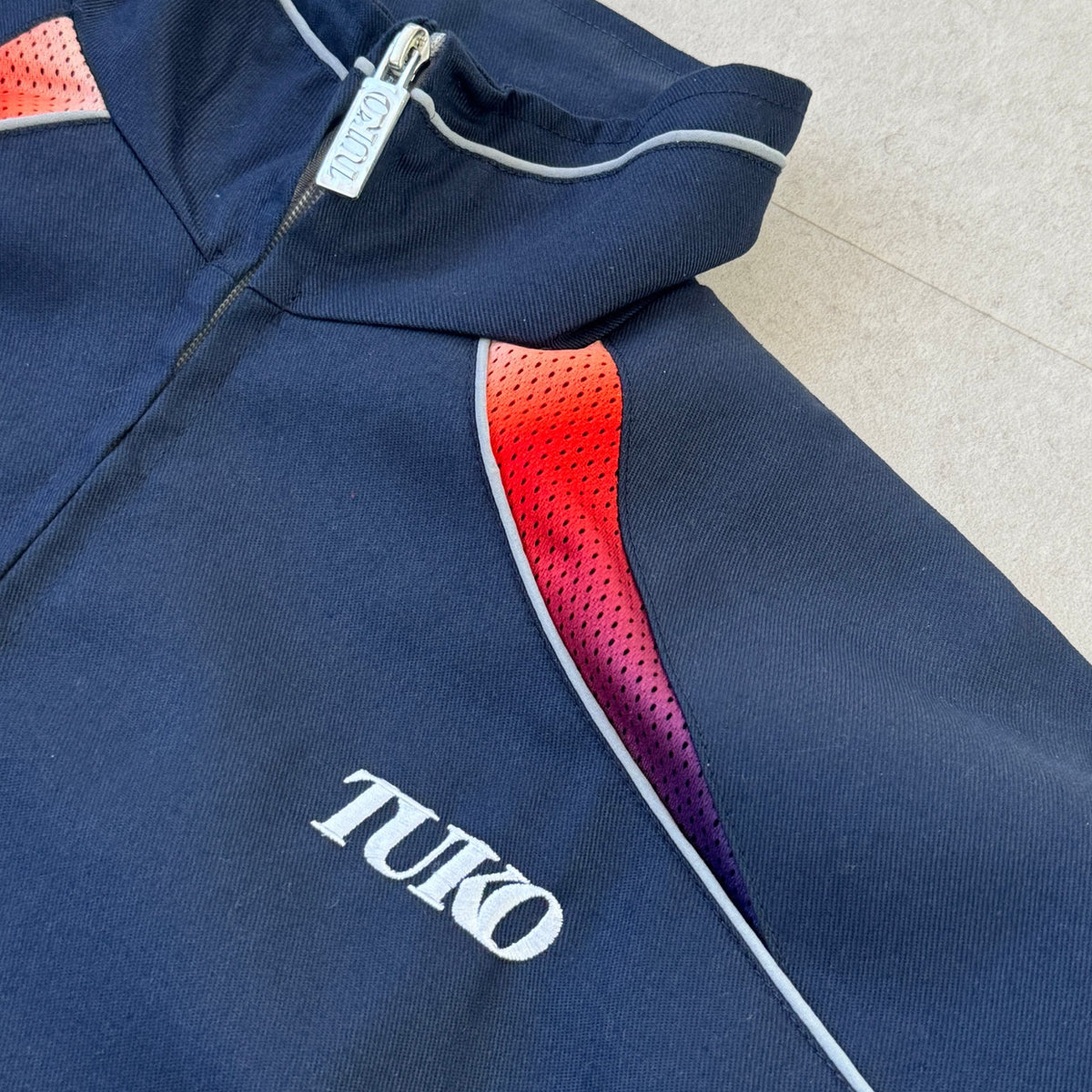 'HOT / COLD' Tech Jacket - collar, zip puller and TUKO logo detail